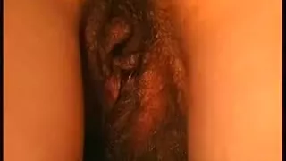 Closeup view of a hairy milf's pussy getting a creampie in doggystyle position