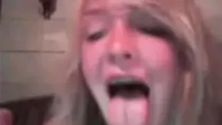 Cute blonde girl masturbates with a dildo on her bed