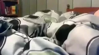 Cute girl with small tits plays with her shaved pussy on her bed