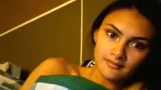 Dark haired girl masturbates with a hairbrush on her bed