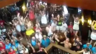 German girls dance in bikini on tables in a bar and flash their tits