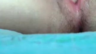 girl fingers her pussy closeup on her bed and gets super wet