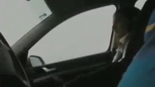 Girl gives a client a blowjob with condom in his car