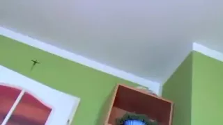 girl rubs her shaved pussy, while her boyfriend  jerks off and shoots a load on her belly.