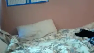 girl takes off her panties after a long day at school and plays with a toy on her bed