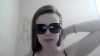 girl with sunglasses masturbates her shaved pussy closeup with a toy