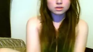 Hot brunette girl plays with her small tits and shaved pussy on her bed