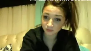 Hot ponytailed brunette girl plays with her small tits and shaved pussy on her bed