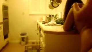 Moaning brunette gets doggystyle fucked in the kitchen