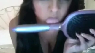 Pigtailed girl roleplays a sex fantasy online, masturbates with a hairbrush and talks dirty.