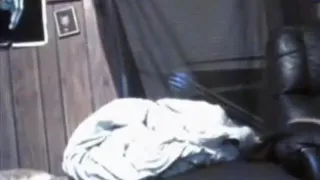 ponytailed brunette girl gives her boyfriend  a blowjob on the bed