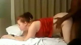 Slutty redhead gets fucked by a black dick.