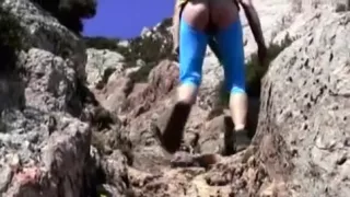 A barefaced golden-haired goes undressed outside in public