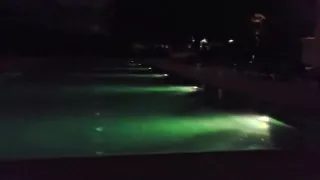 Squat pissing at public hotel pool shower room