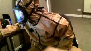 Cumming in a vintage rubber hazmat costume