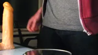 Juvenile fellow in chastity, sex-toy prostate milking, eats it all.