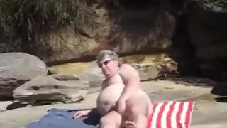 bare large fellow at beach