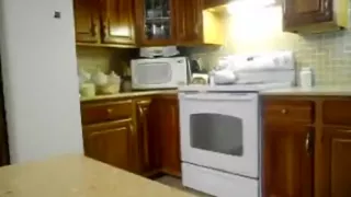 Daddy makes a snack in the kitchen