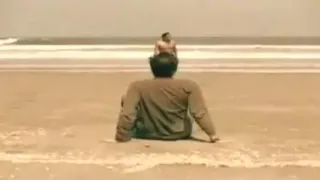 Undressed lad in beach