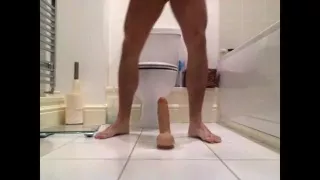 Slut fucks himself with dildo