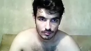 Attractive boyfriend is having fun in his room and shooting himself on camera