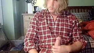 Attractive boyfriend is relaxing at home and memorializing himself on web cam