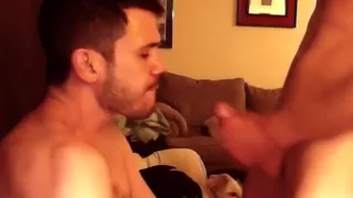 Nice-looking man is playing in his room and shooting himself on camera