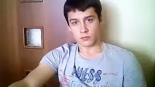 Charming guy is jerking off in the bedroom and shooting himself on webcam