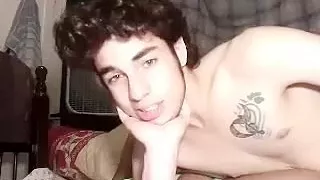 Cute boyfriend is beating off in the guest room and shooting himself on web cam