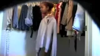 Curvaceous ebon dominatrix-bitch puts on her garments on web camera