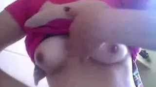 Cute Filipina woman flashing her perky breasts on web camera