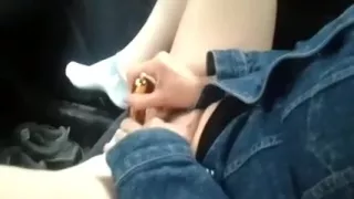 Golden toy vibrates and her pussy receives wet in her car
