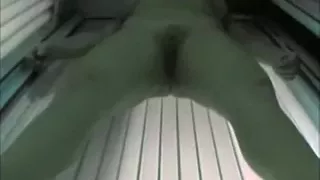 Hot blonde temptress tans her adorable body in solarium