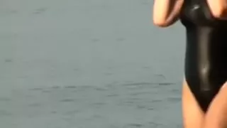 Sexy swimsuit on hot mulatto babe at the beach