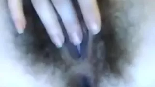 Naughty and bushy constricted cunt of the white honey acquires fingered by herself