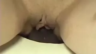 The dark weenie in the gloryhole creampies my white cookie