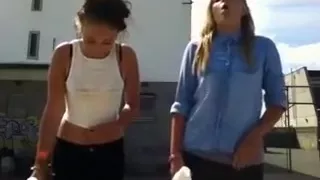 two young girls do the milk challenge