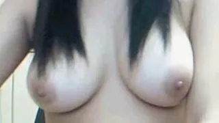 Asian girl masturbates for the webcam.