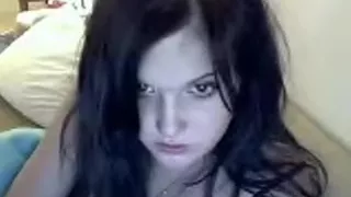 Woman masturbates with large toy.