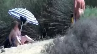 Pervert granny masturbates in front of stranger at beach