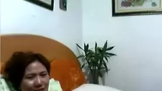 Chinese MILF cums loud.
