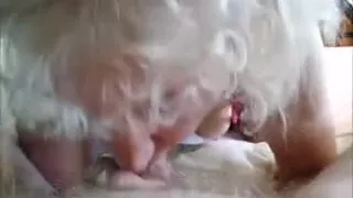 One More view of the pleasant lady working on an old strapon..