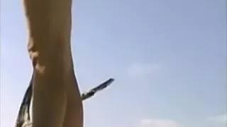 Naked beach - angel oiled body and walking