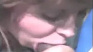 Wife sucks darksome ding-dong at the park