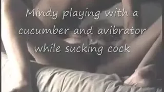 Mindy playing with cucumber and sextoy whilst engulfing dick