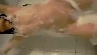 Hot girl strips and dances under shower