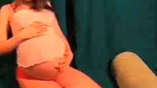 Posing and showing my pregnant tummy