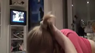 Golden-Haired angel is sucking on a hard strapon