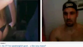 Sexy boy in baseball cap jacks on web camera