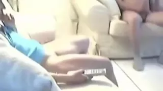 fellow is stroking during the time that his cutie is watching television  that guy drops his jizz on her legs